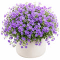 Planta Artificial Decorativa con Flores Moradas en Maceta Blanca